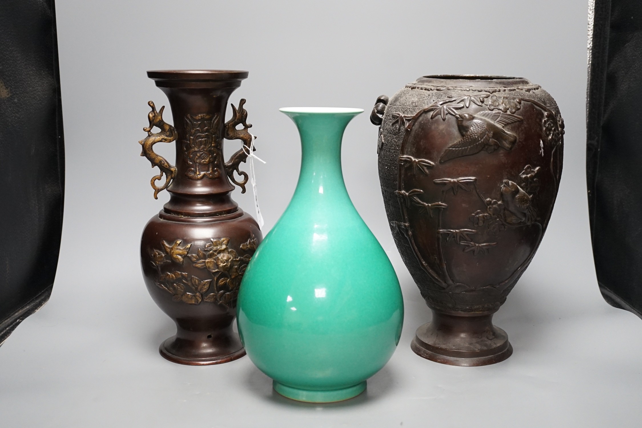 A Chinese green glazed vase with Qianlong seal mark to base and two Japanese bronze vases, tallest 29.5cm